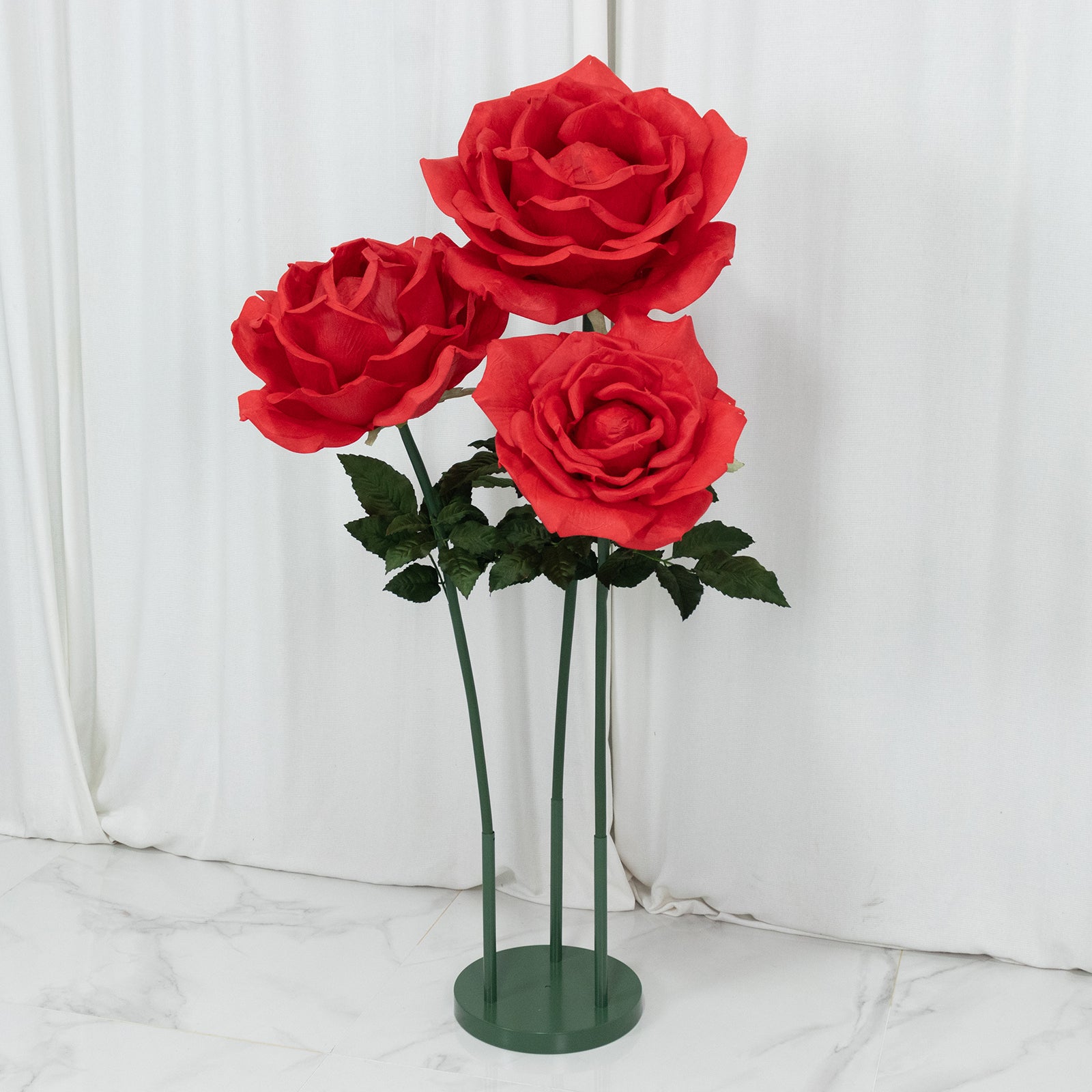 Giant red artificial rose set with base, 3 faux flowers for events and photo booths.