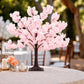 Blush pink silk cherry blossom tree centerpiece with metal base.