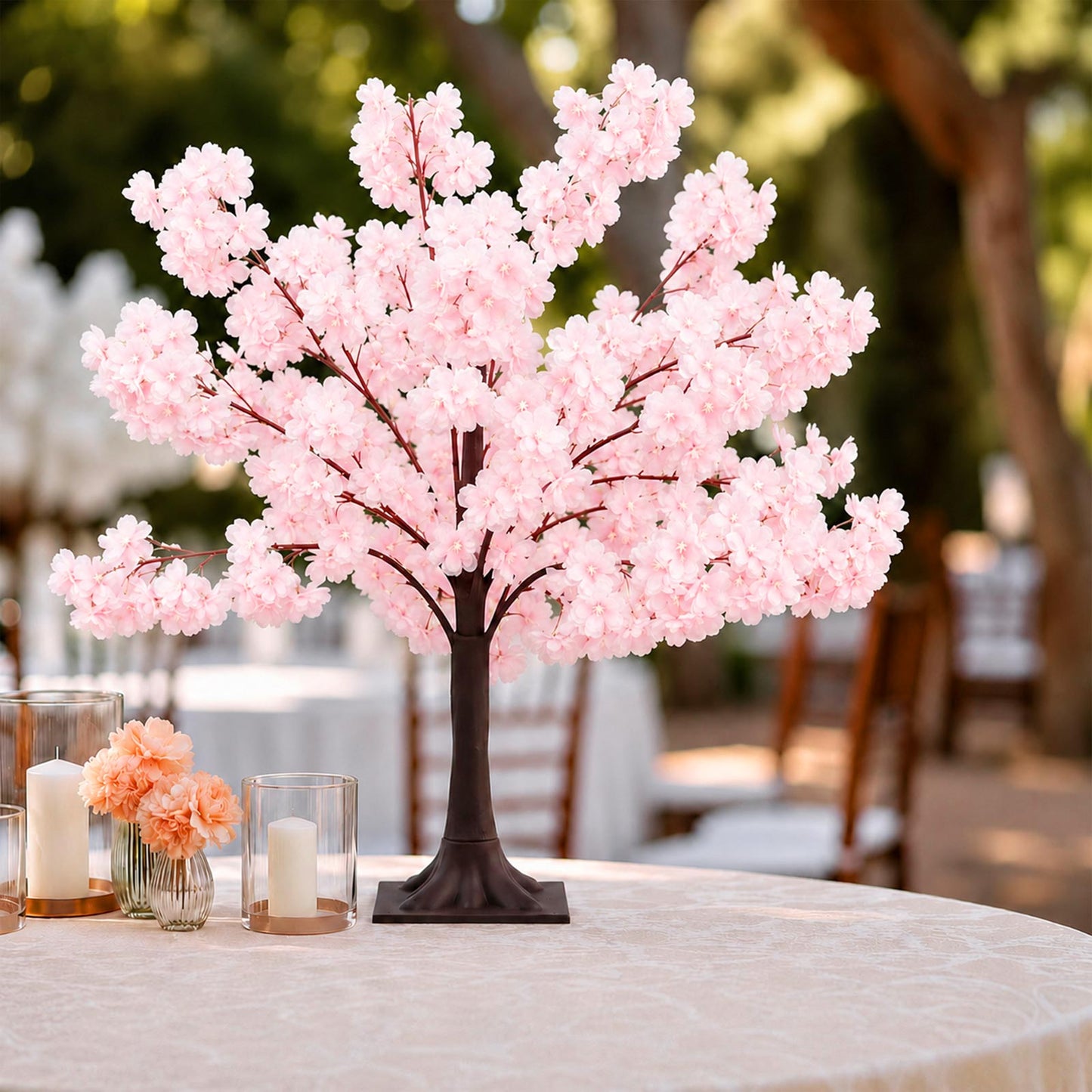 Blush pink silk cherry blossom tree centerpiece with metal base.