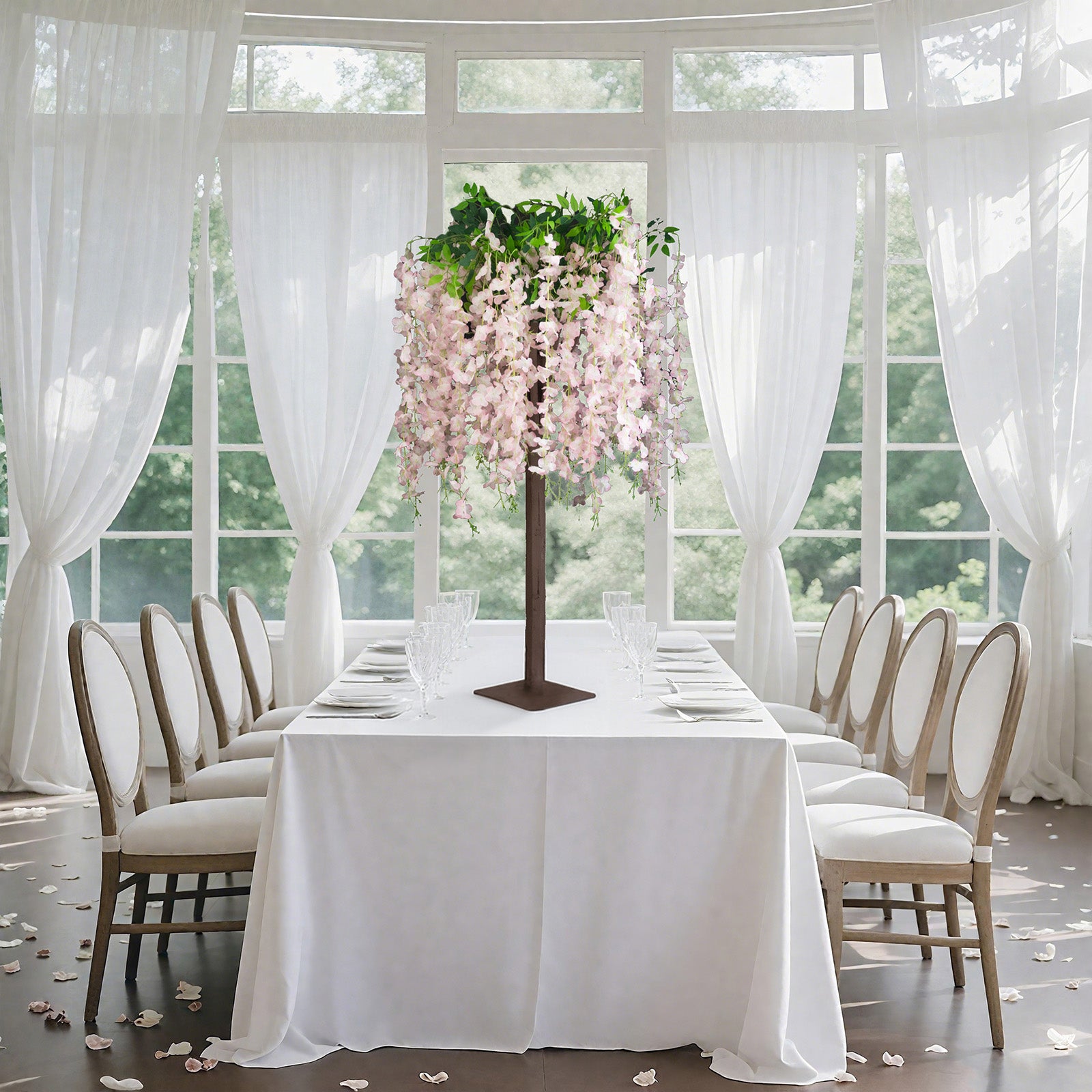 Blush artificial wisteria tree with cascading silk flowers for event centerpieces.