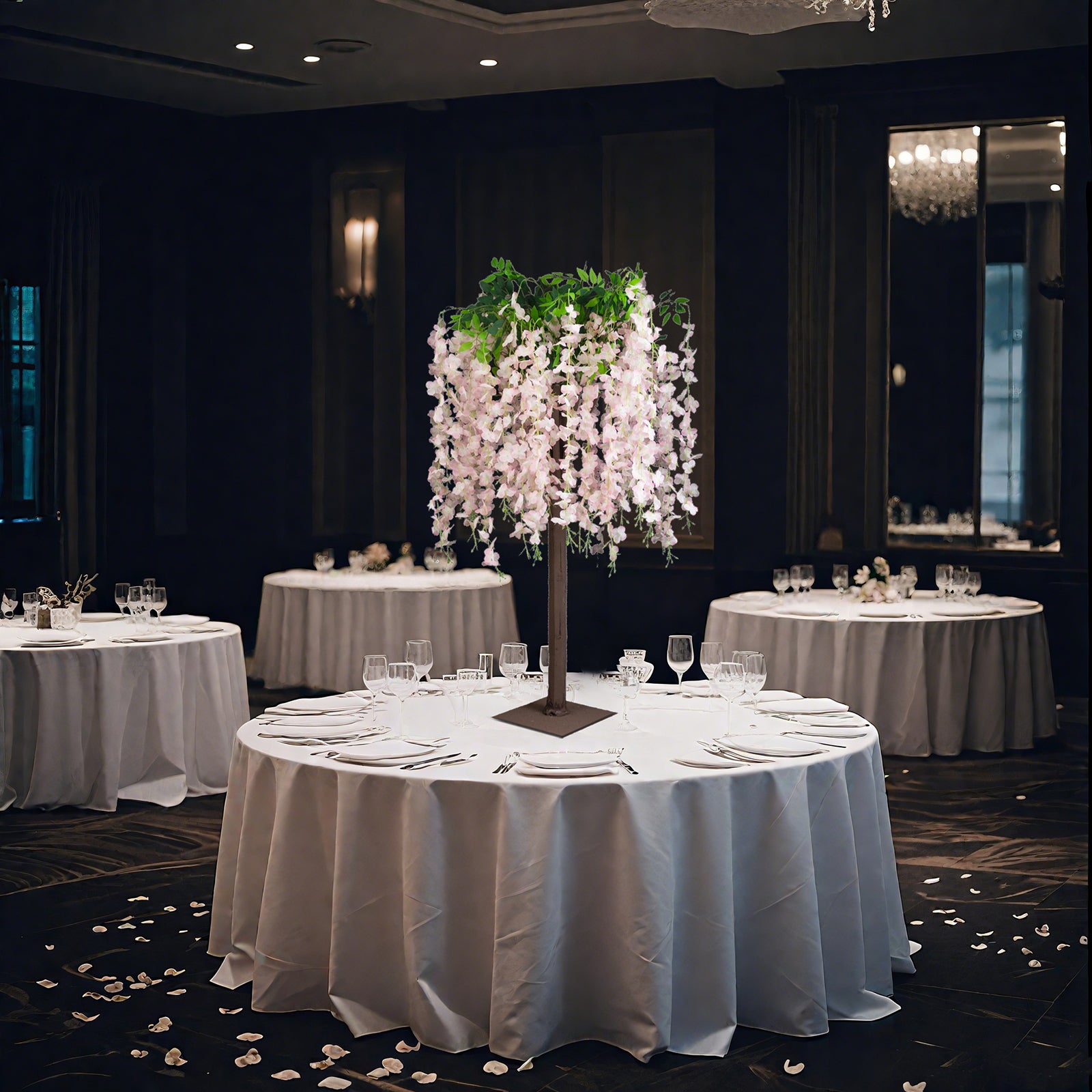 Blush artificial wisteria tree centerpiece for elegant wedding table decor.