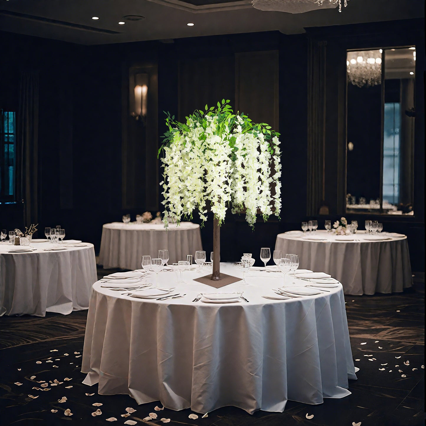 Cream artificial wisteria tree centerpiece with cascading silk flowers.