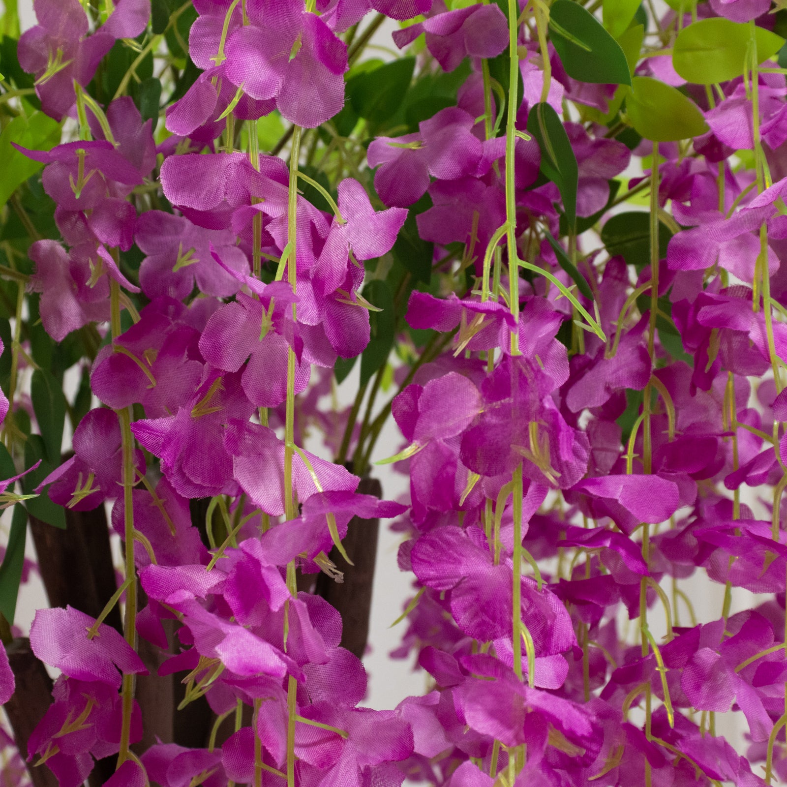 Lavender lilac artificial wisteria tree with cascading silk flowers.