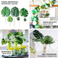 Assorted green artificial silk tropical monstera leaves arrangement.