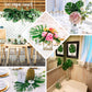 Assorted green artificial silk tropical monstera leaf plants in various decor settings.