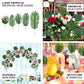 Assorted green artificial silk tropical palm leaf plants for decoration.