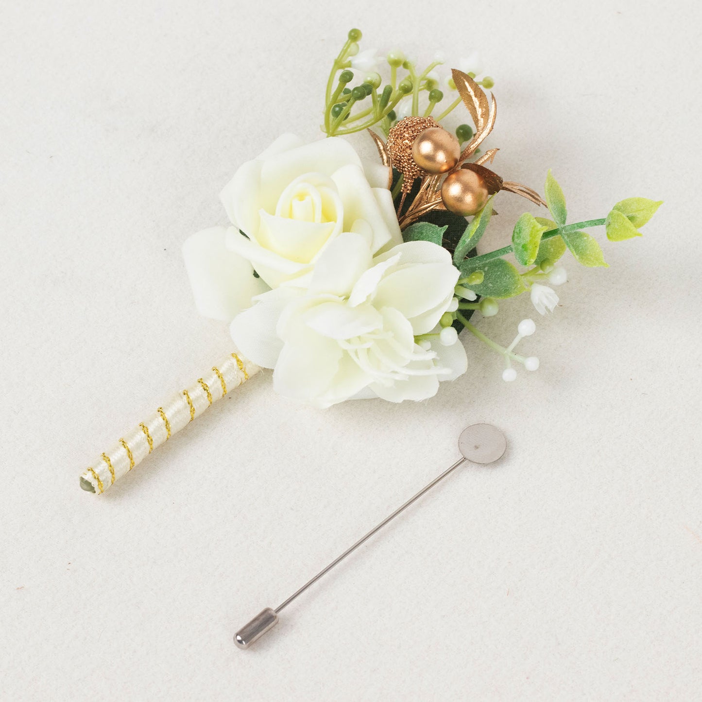 White artificial rose boutonniere with pin, perfect for formal occasions.