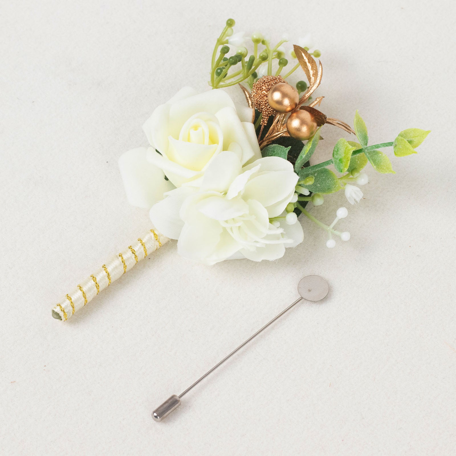 White artificial rose boutonniere with pin, perfect for formal occasions.