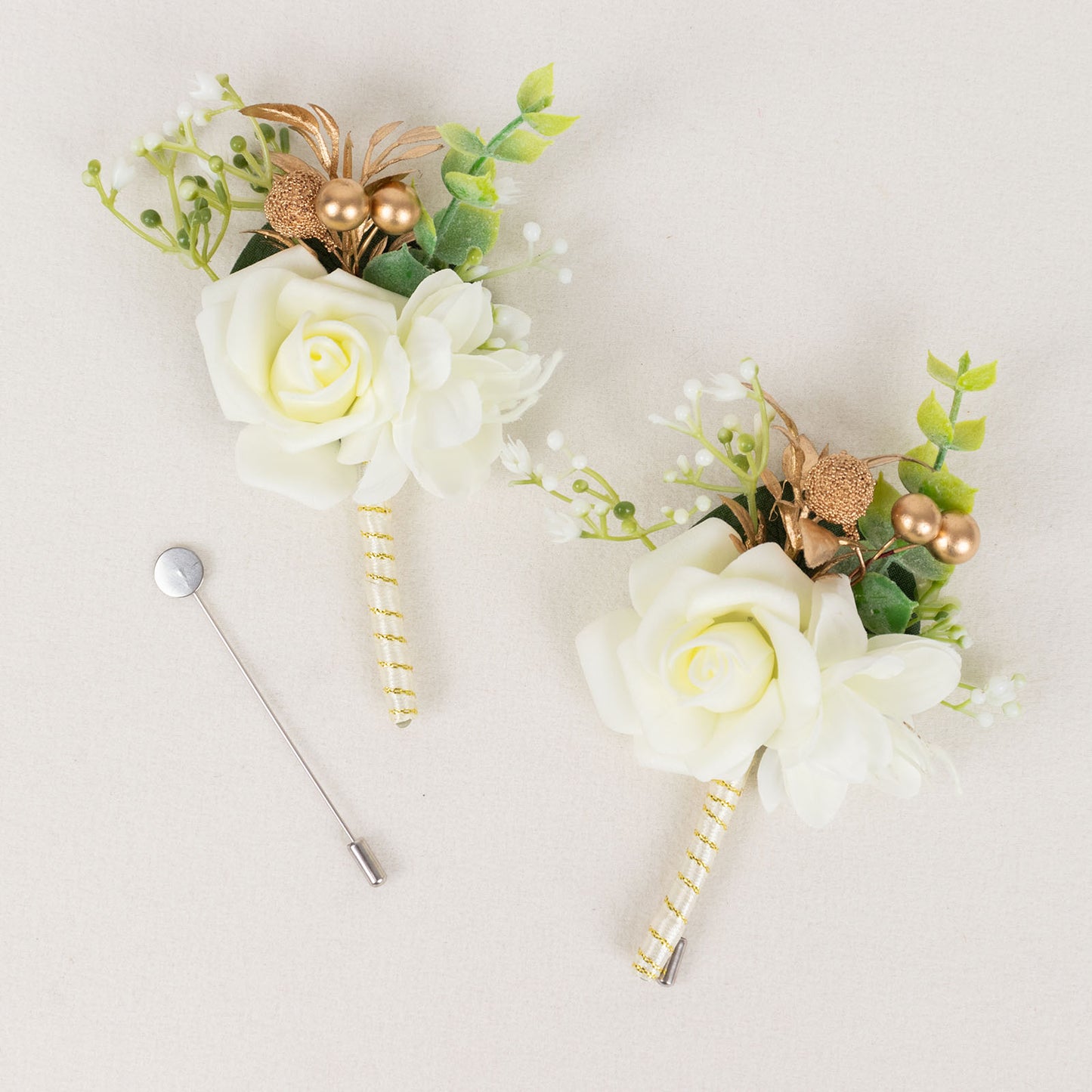 White artificial rose boutonniere with pin, perfect for weddings or formal events.