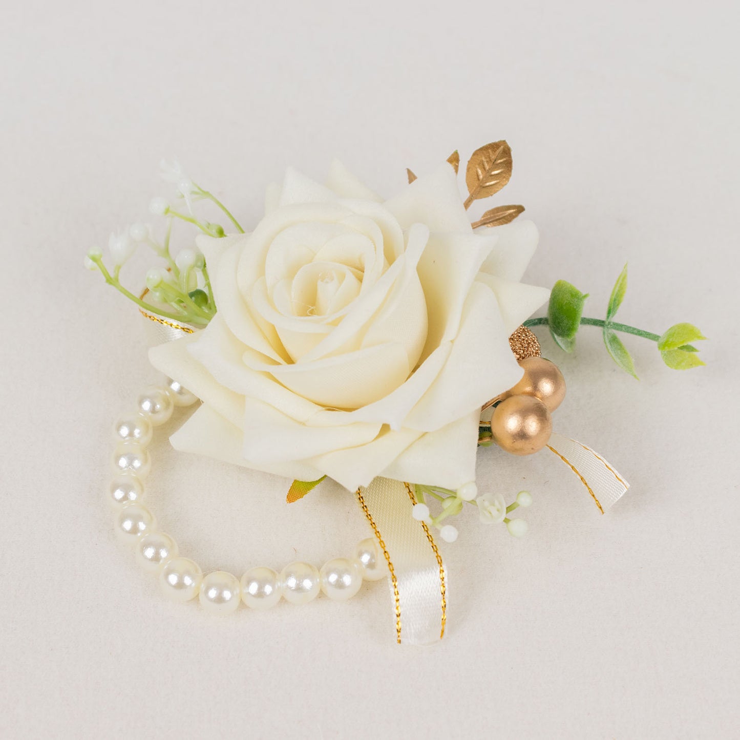 White artificial rose wrist corsage with pearls for weddings.