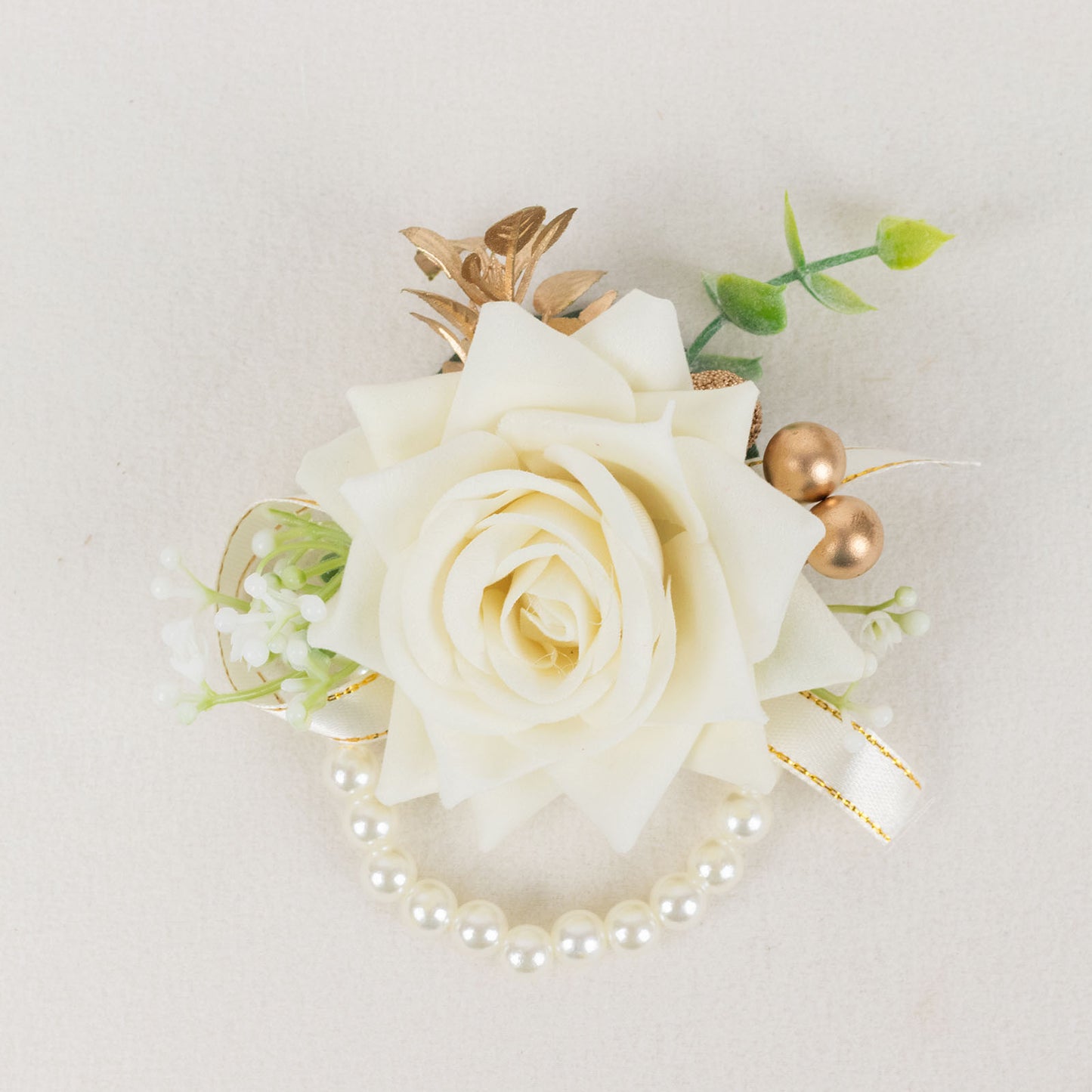 White artificial rose wrist corsage with pearls for weddings.