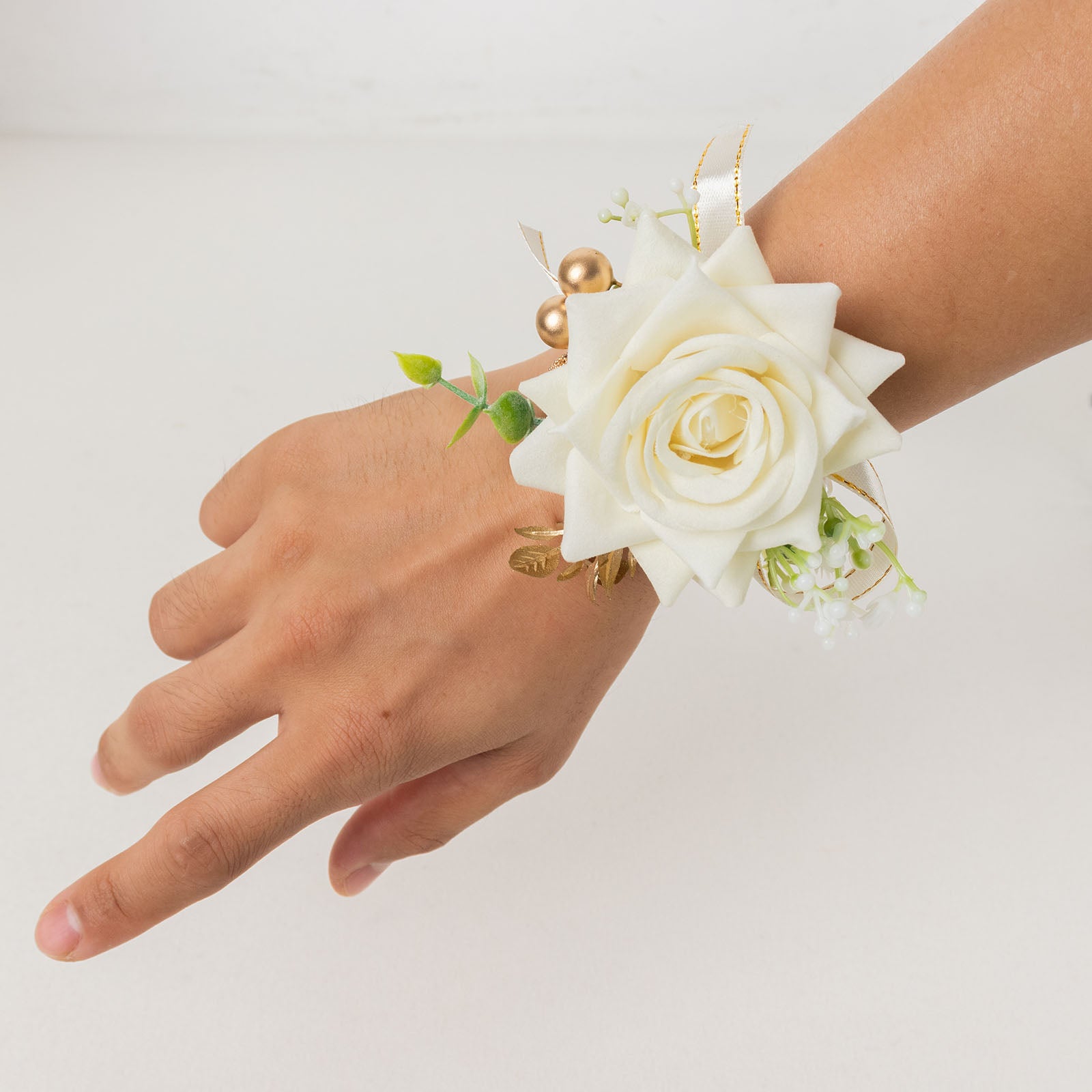 White artificial rose wrist corsage with pearls for wedding accessories.