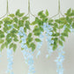 Light blue silk hanging wisteria flower garland vines with greenery.