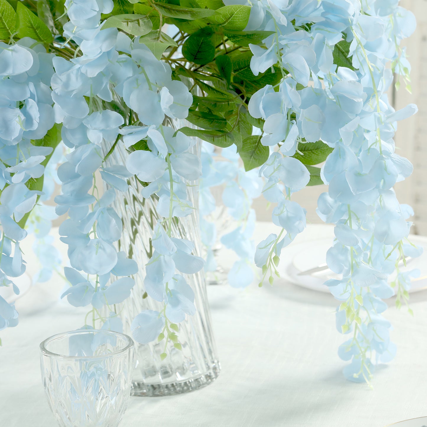 Light blue silk wisteria flower garland vines, perfect for decoration.