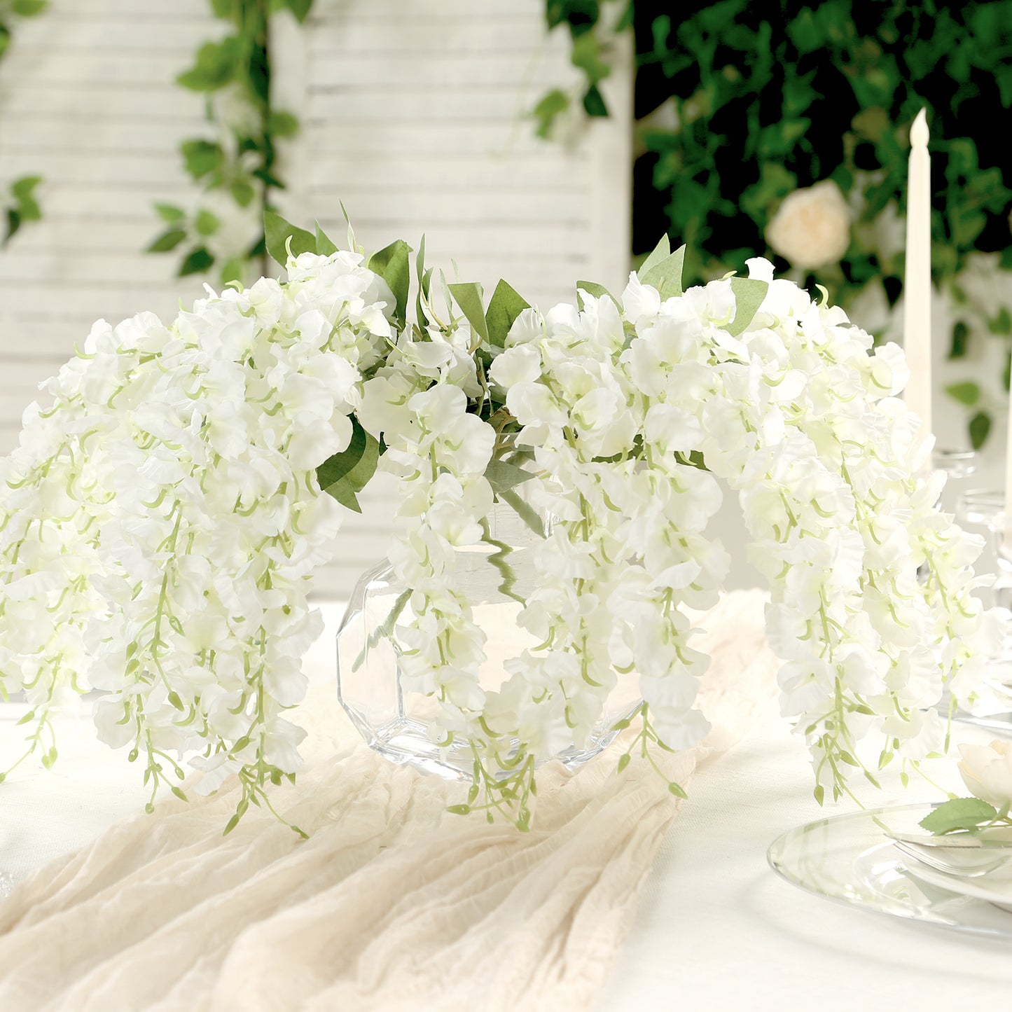 White wisteria vines hanging plants in a decorative arrangement.