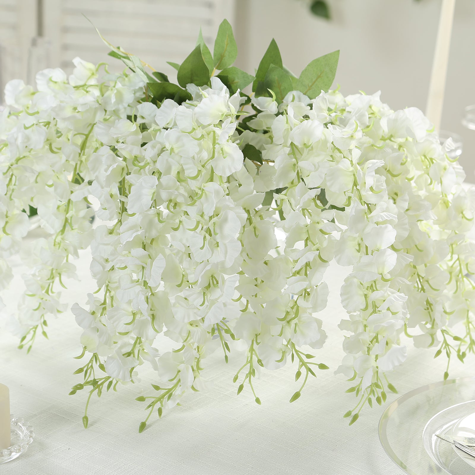 White artificial wisteria vines with lush greenery, perfect for home decor.