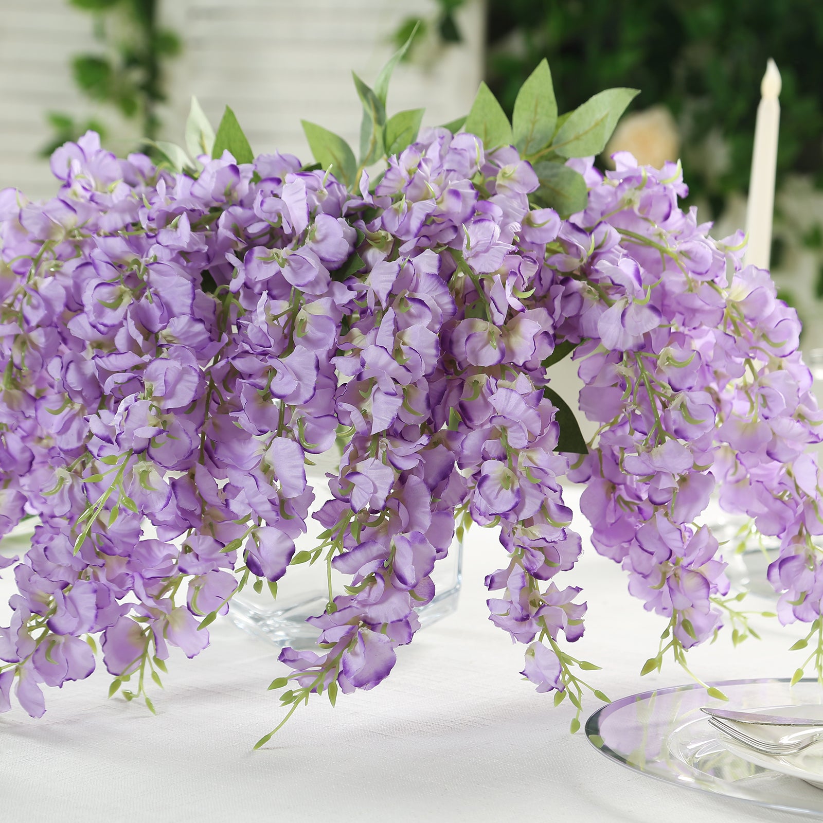 Purple silk wisteria vines hanging plants in a decorative arrangement.