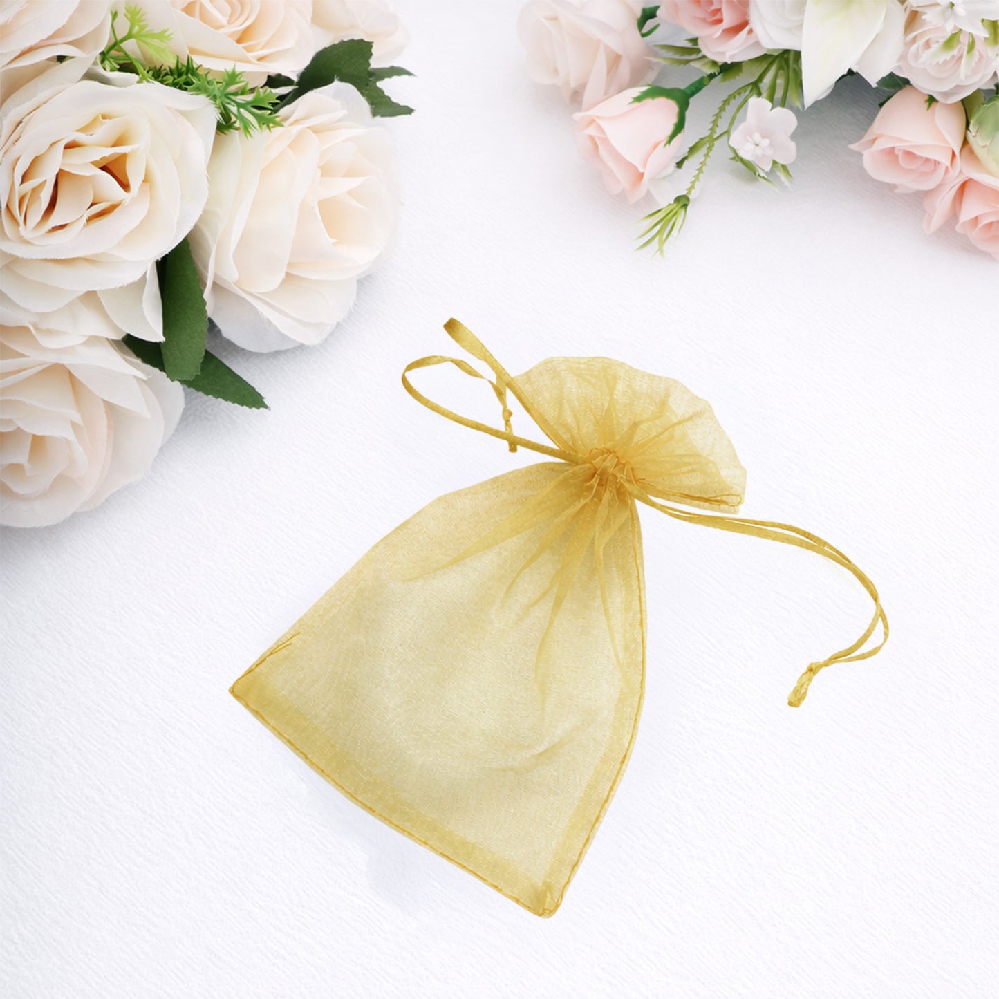 Gold organza gift bag with drawstring, 4" x 6", perfect for wedding favors.