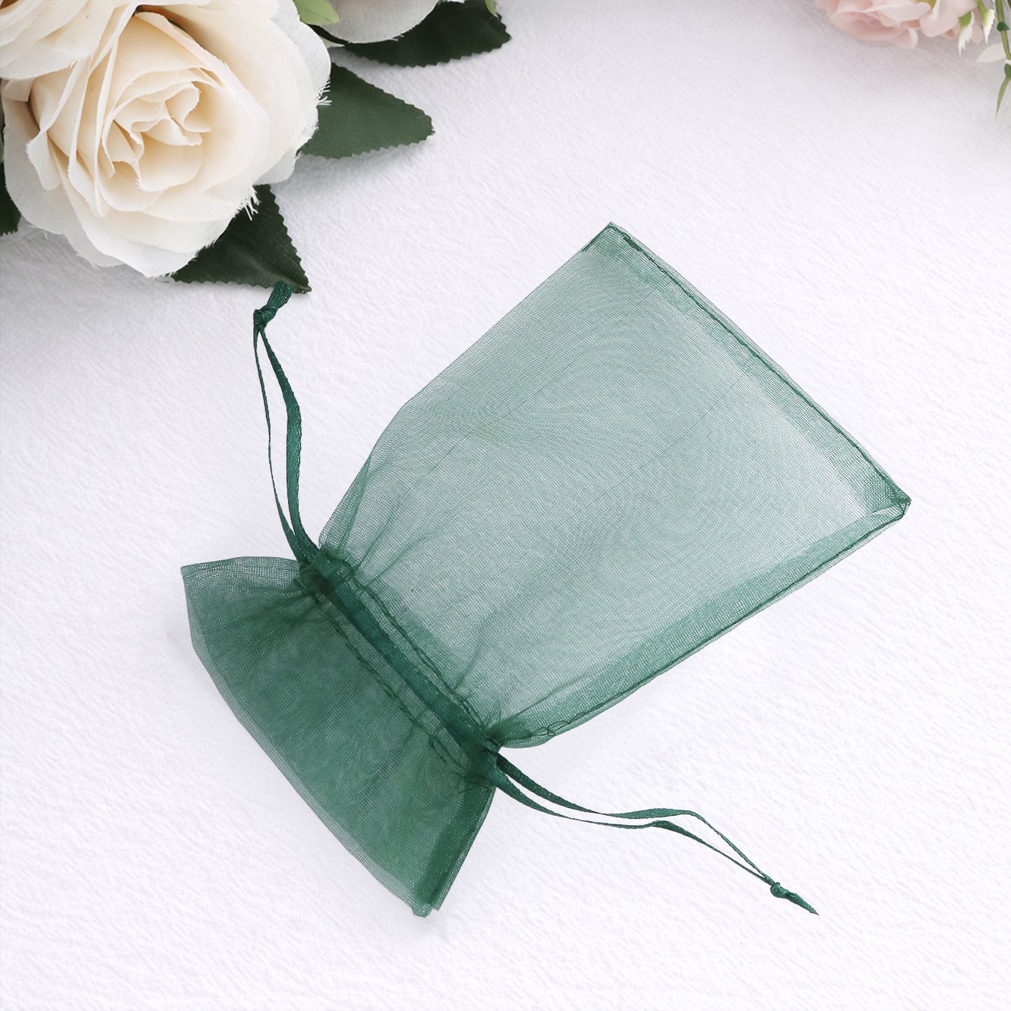 Hunter emerald green organza gift bag with drawstring, perfect for favors.
