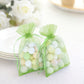Mint organza gift bags with drawstring, filled with colorful balls.