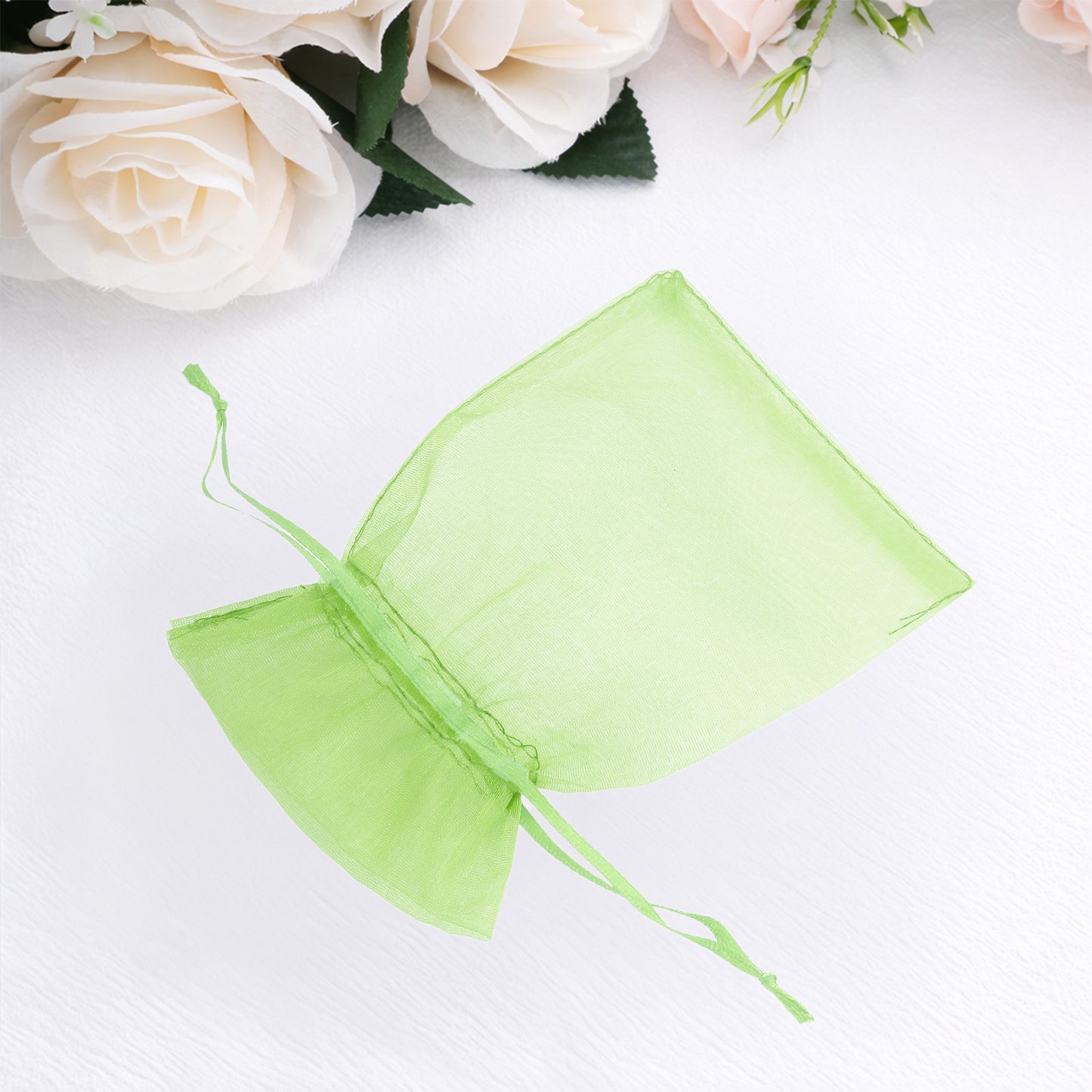 Mint organza gift bag with drawstring, 4" x 6", perfect for wedding favors.
