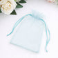 Light blue organza gift bag with drawstring, 5" x 7" for wedding favors.
