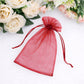 Burgundy organza gift bag with drawstring, perfect for wedding favors.