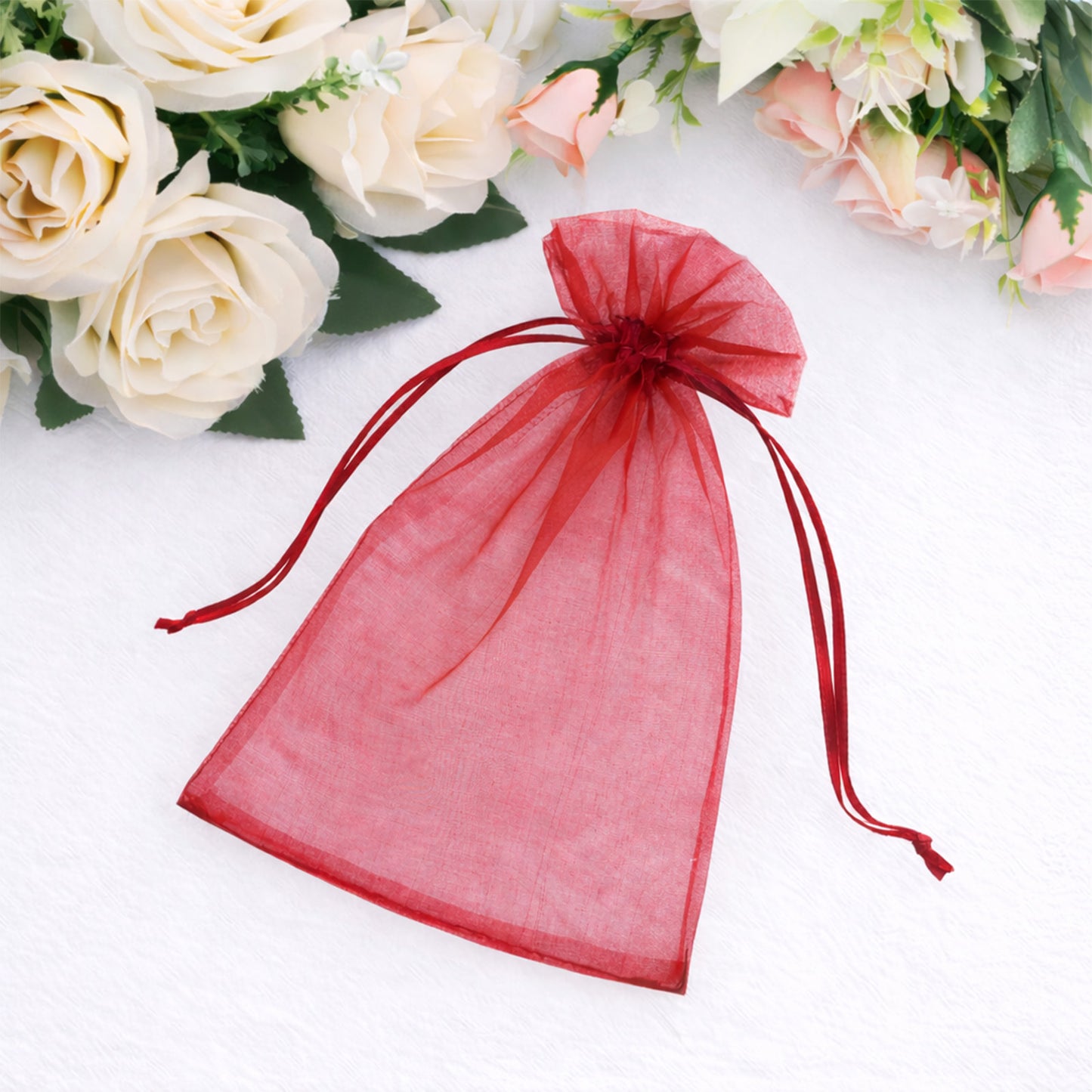 Burgundy organza gift bag with drawstring, perfect for wedding favors.