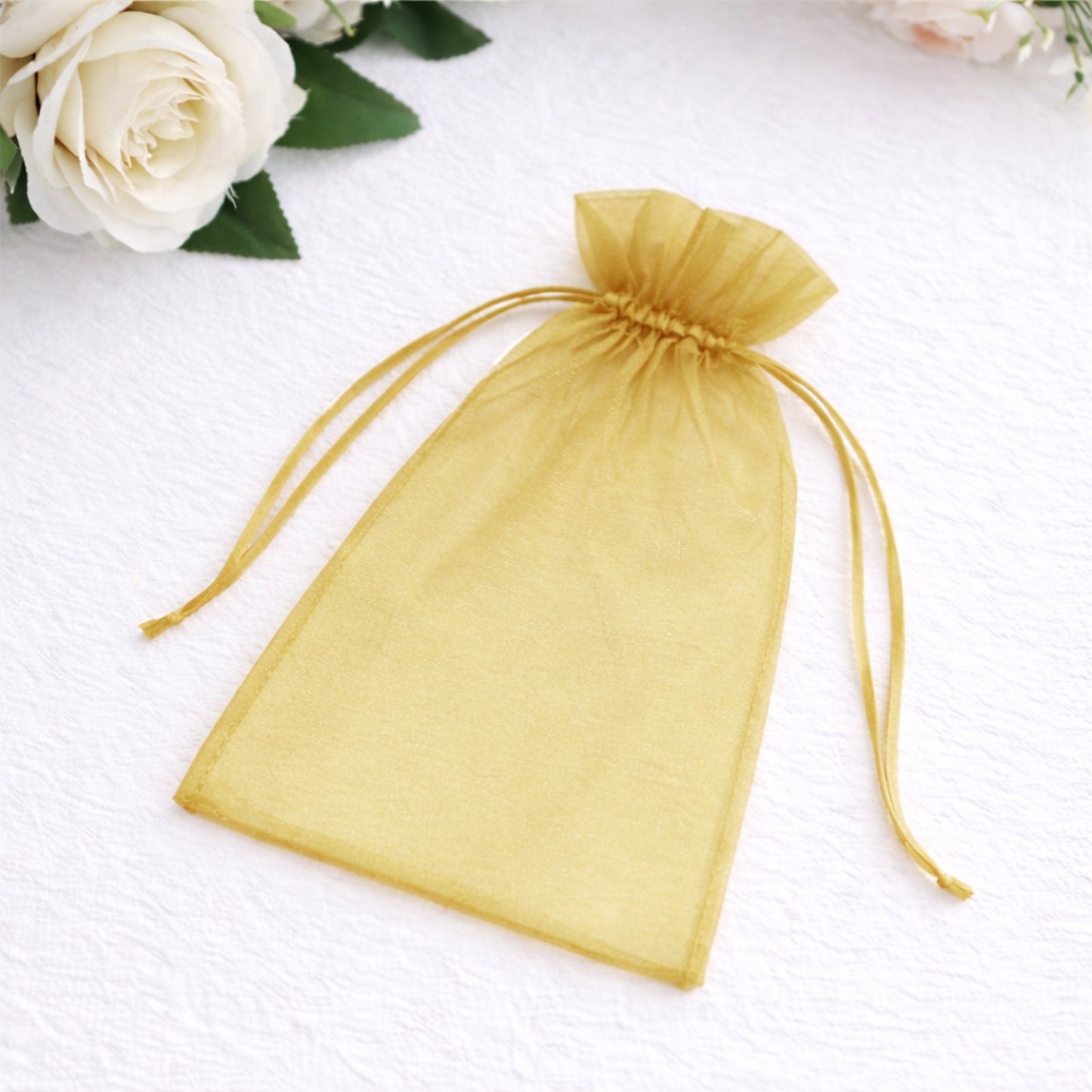 Gold organza gift bag with drawstring, 5" x 7", perfect for wedding favors.
