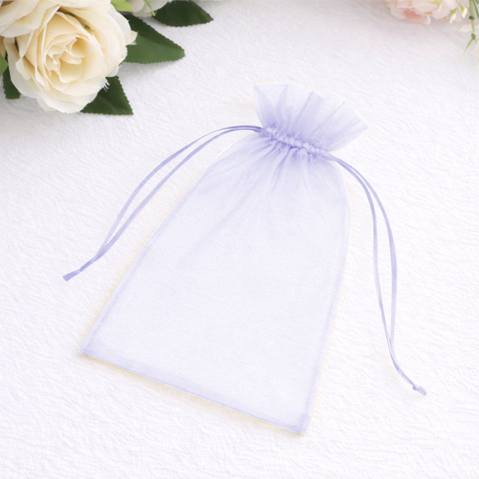 Lavender organza gift bag with drawstring, 5" x 7" for wedding favors.