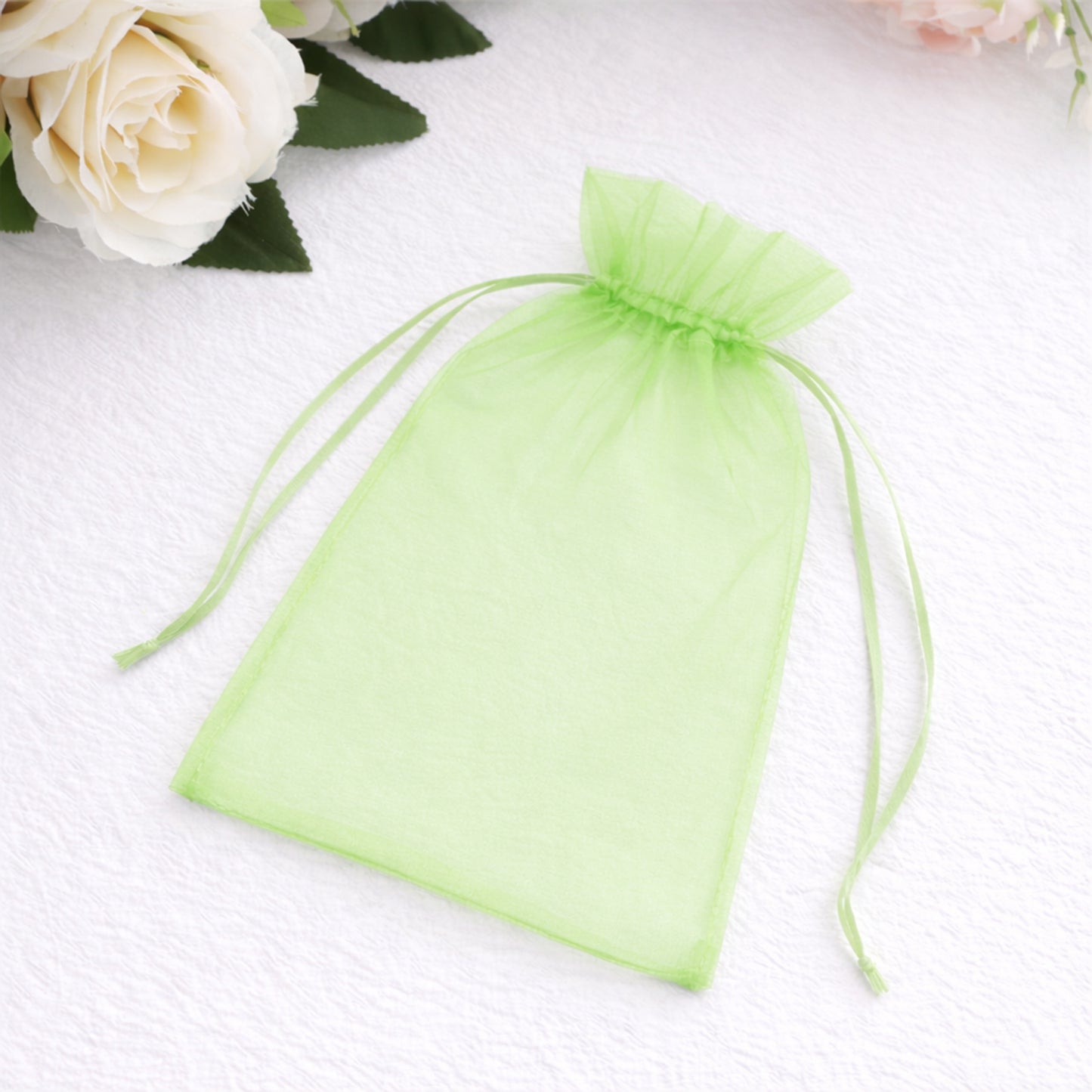 Mint organza gift bag with drawstring, 5" x 7", perfect for party favors.