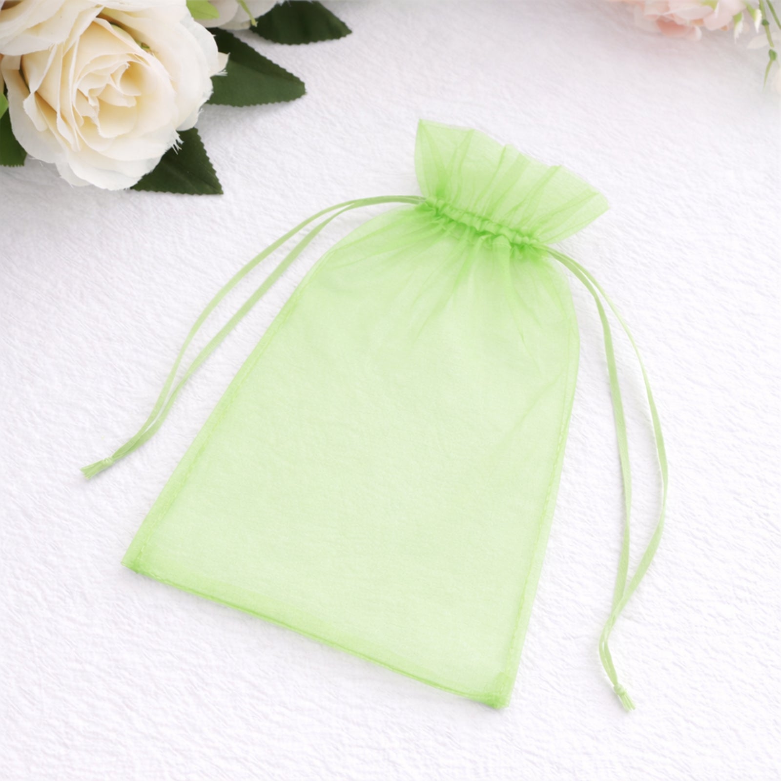 Mint organza gift bag with drawstring, 5" x 7", perfect for party favors.