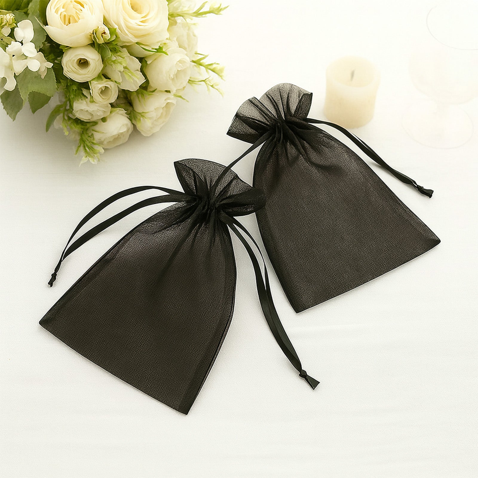 Black organza gift bags with drawstring, 6" x 9". Perfect for weddings and parties.