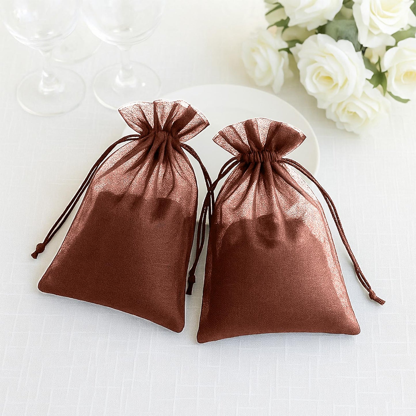 Brown organza gift bags with drawstring, ideal for wedding favors.
