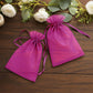 Fuchsia organza gift bags with drawstring, perfect for wedding favors.