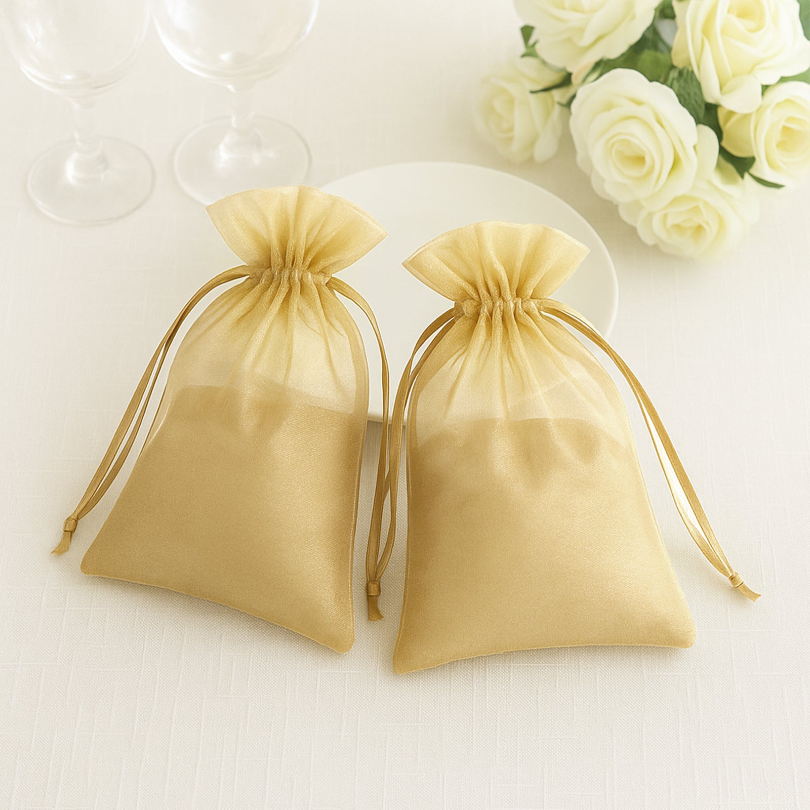 Gold organza gift bags with drawstring, 6" x 9", perfect for wedding favors.