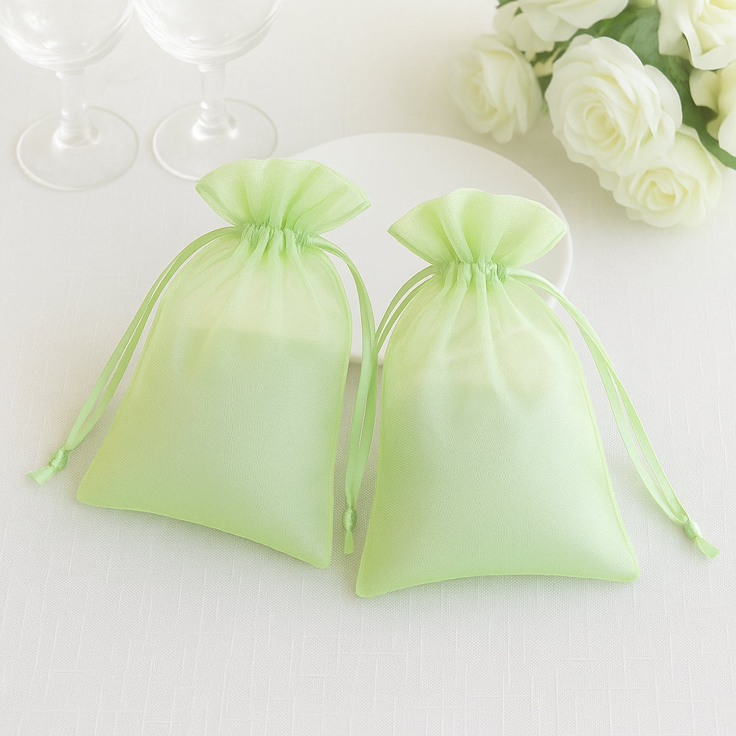 Mint organza gift bags with drawstring, 6" x 9", perfect for wedding favors.
