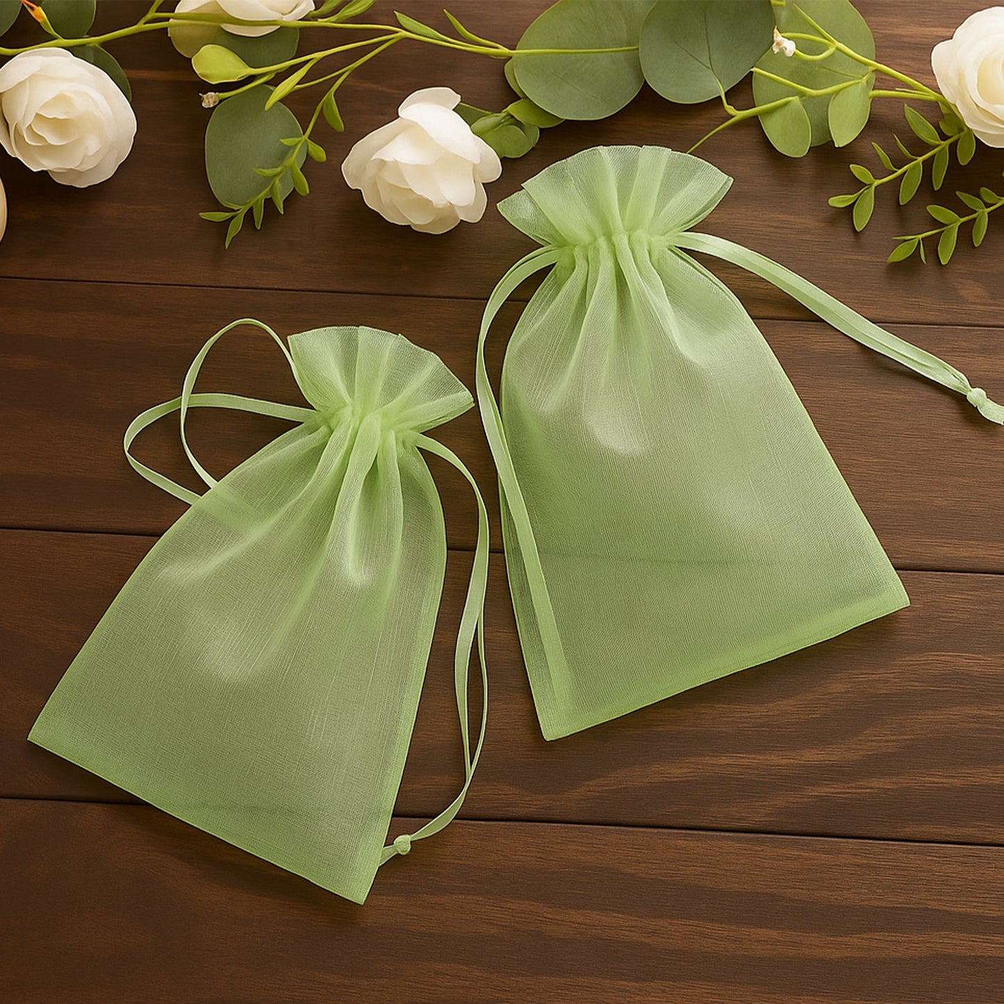 Mint organza gift bags with drawstring, perfect for wedding favors.