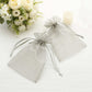 Silver organza gift bags with drawstring, perfect for wedding favors.