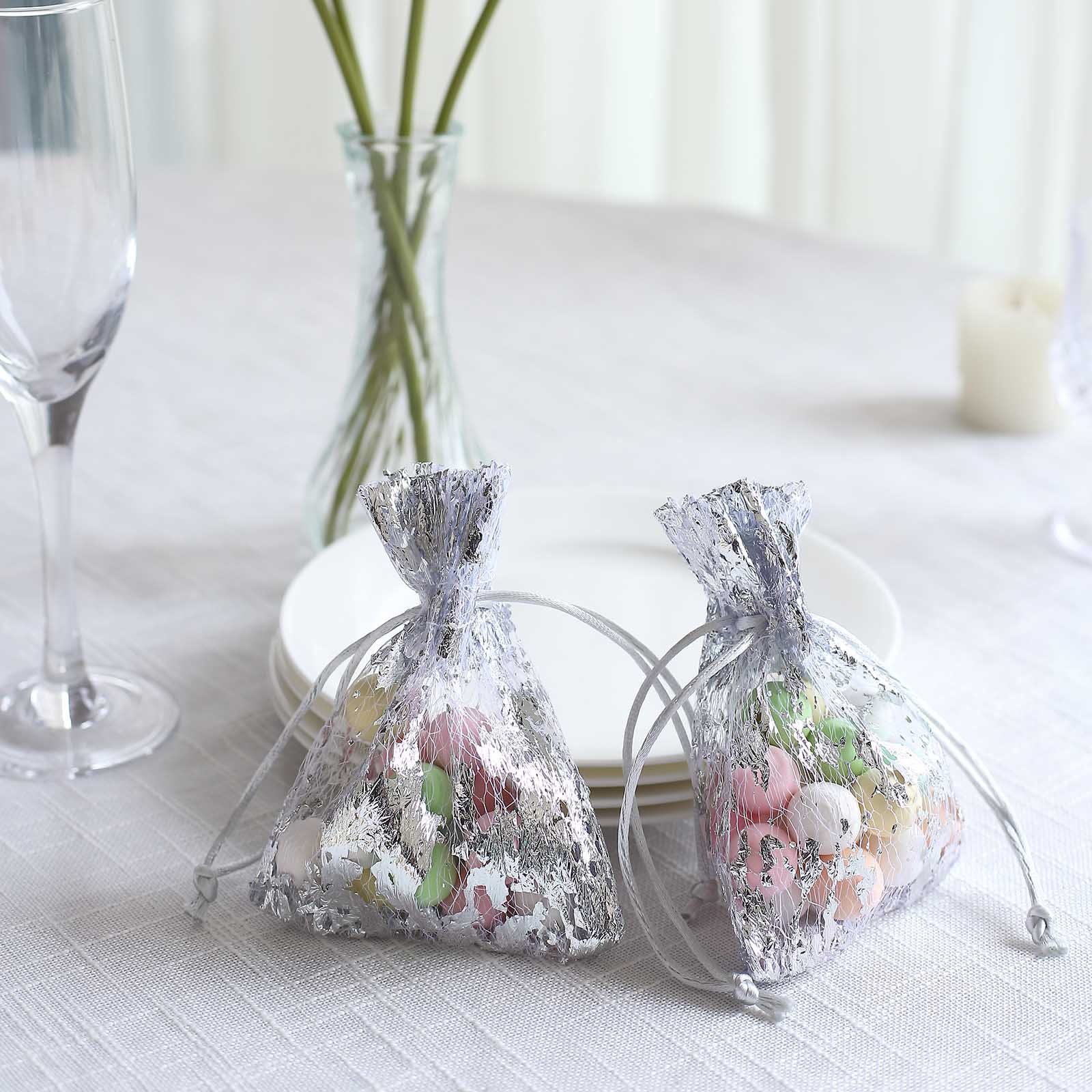 Metallic silver foil drawstring candy bags for wedding party favors.