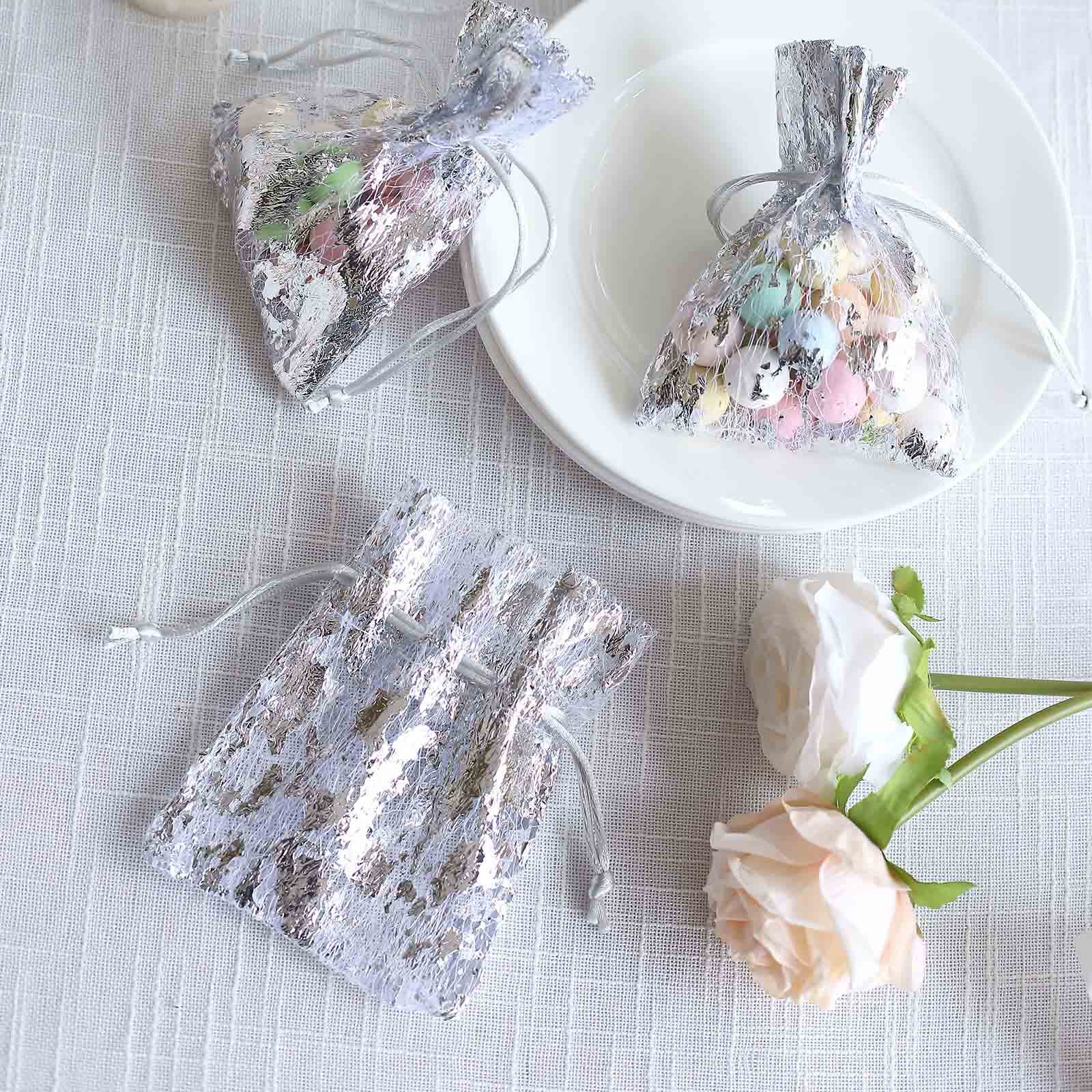 Metallic silver foil drawstring candy bags with pastel candies.