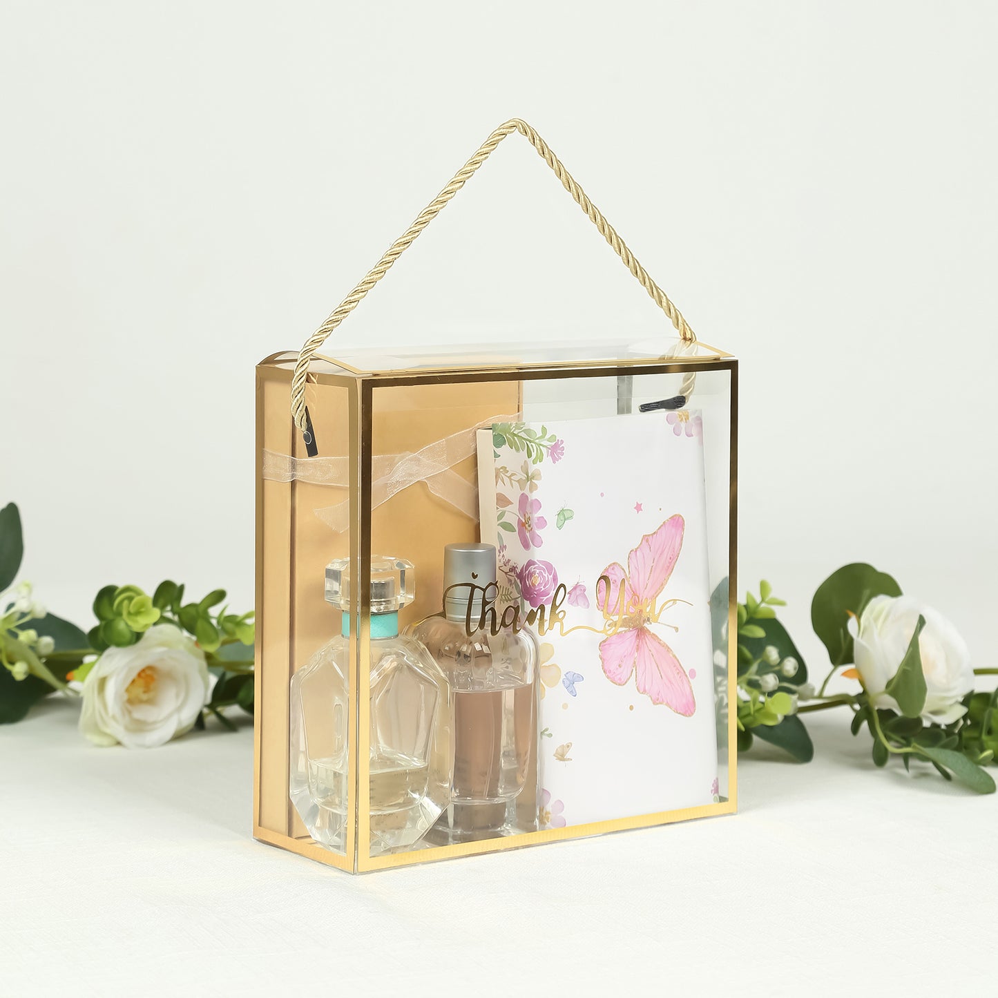 Gold trimmed clear PVC gift box with rope handle and thank you note.