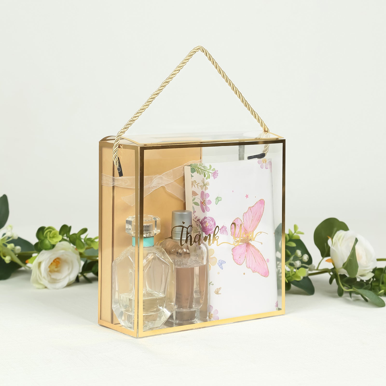 Gold trimmed clear PVC gift box with rope handle and thank you note.