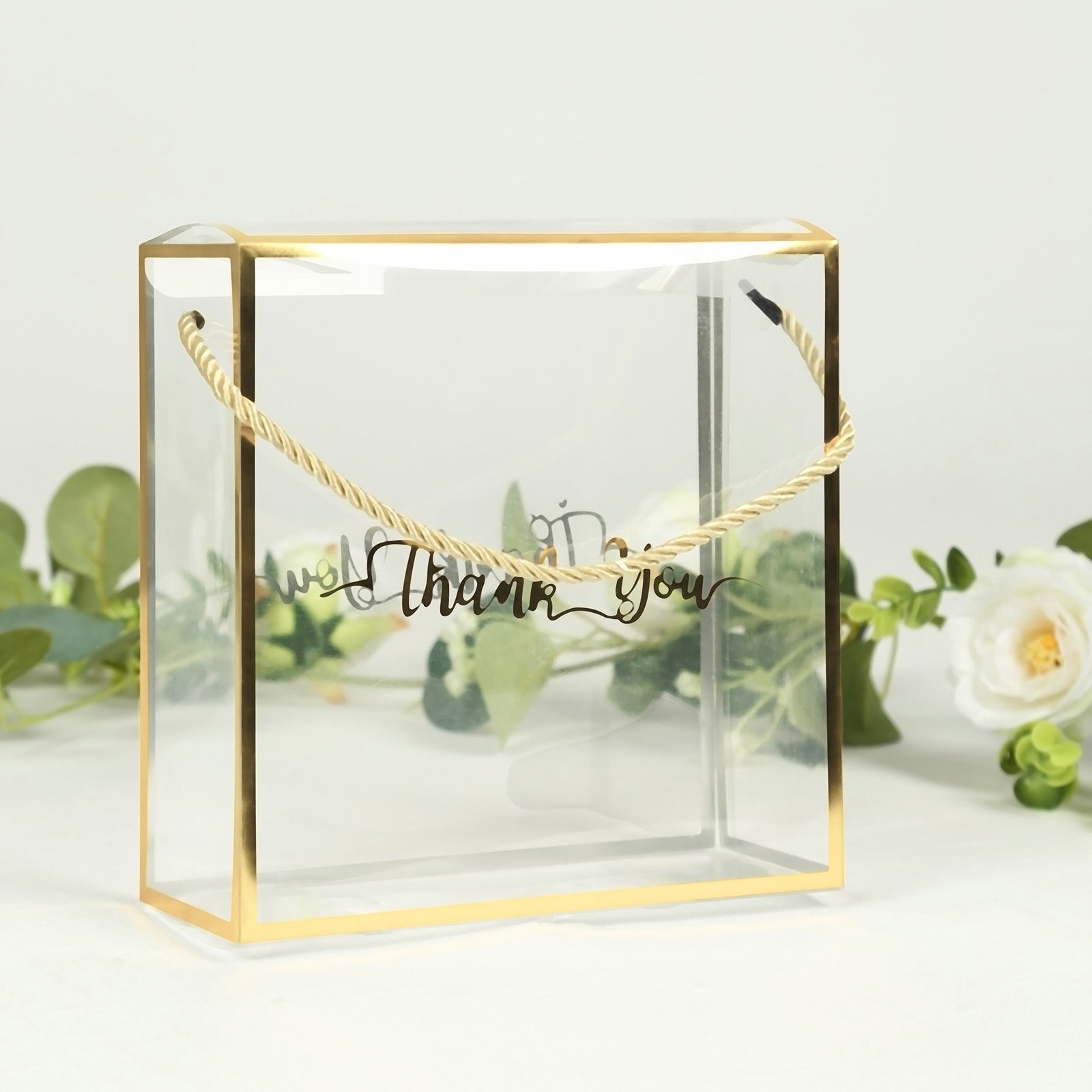 Gold trimmed clear PVC gift box with rope handle and "Thank You" print.