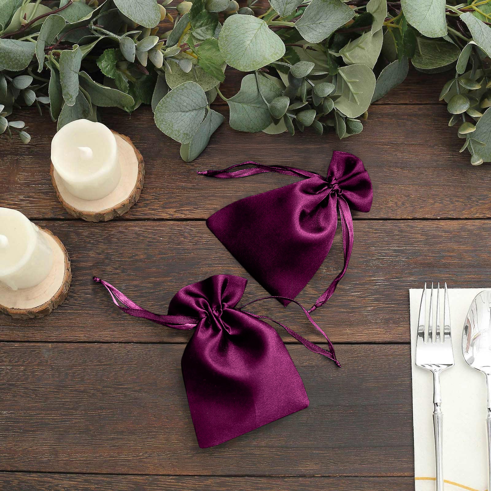 Eggplant satin drawstring favor bags for weddings and parties.