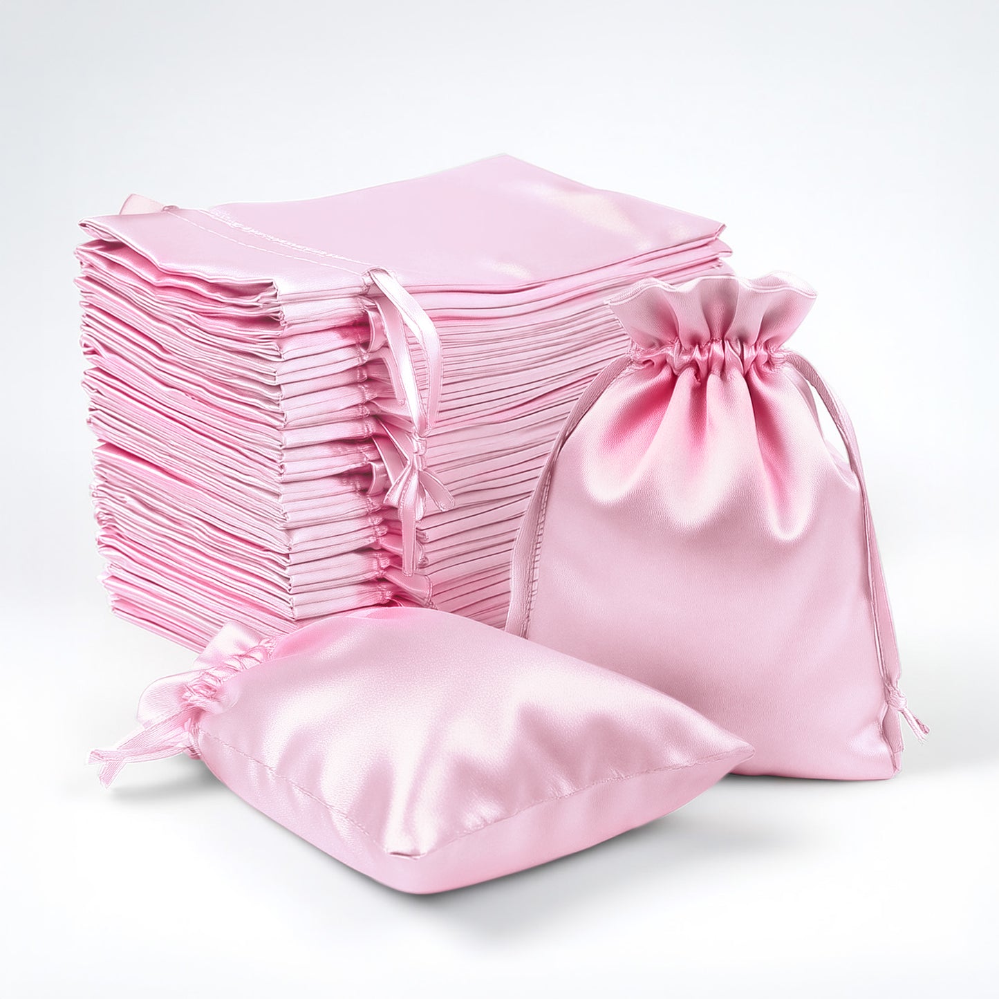Pink satin drawstring gift bags, 60 pack, perfect for favors and accessories.