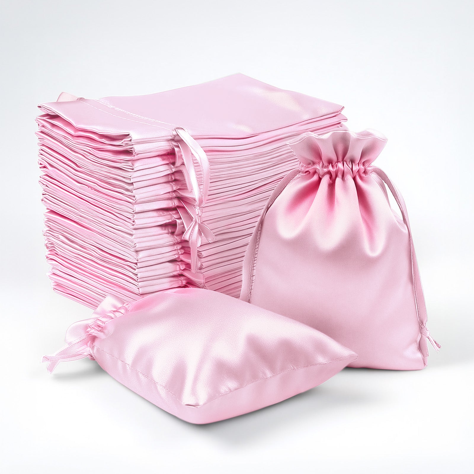 Pink satin drawstring gift bags, 60 pack, perfect for favors and accessories.