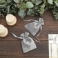 Silver satin drawstring favor bags for weddings and parties.
