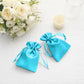 Turquoise satin drawstring bags for jewelry and candy gifts.