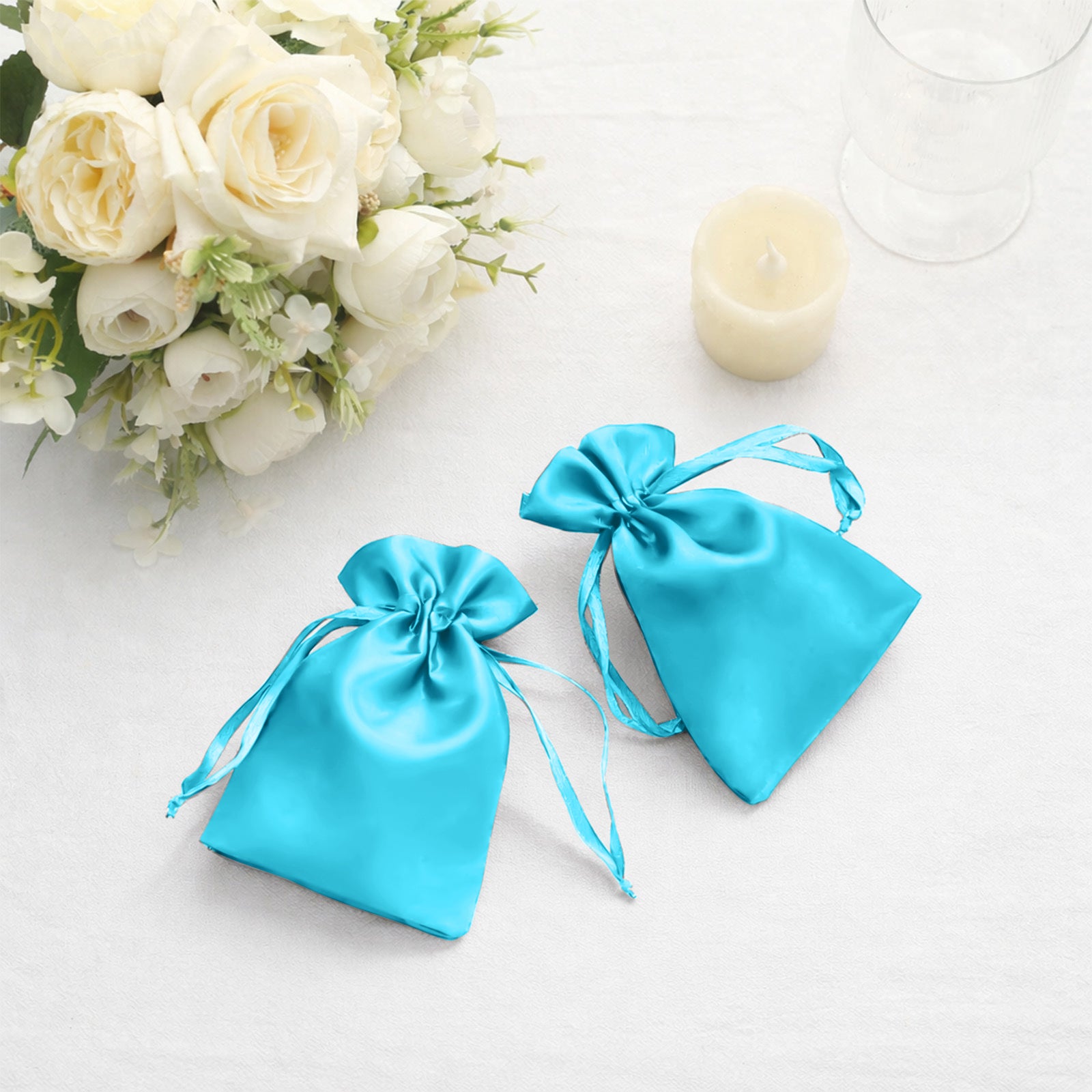 Turquoise satin drawstring bags for jewelry and candy gifts.